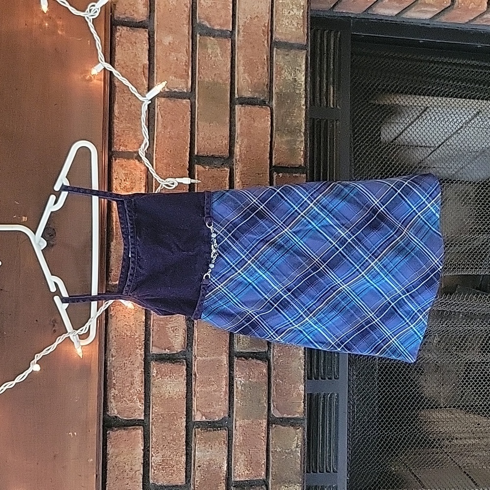 Cute girl size 5 dress. These are different colors of blue in this dress.
